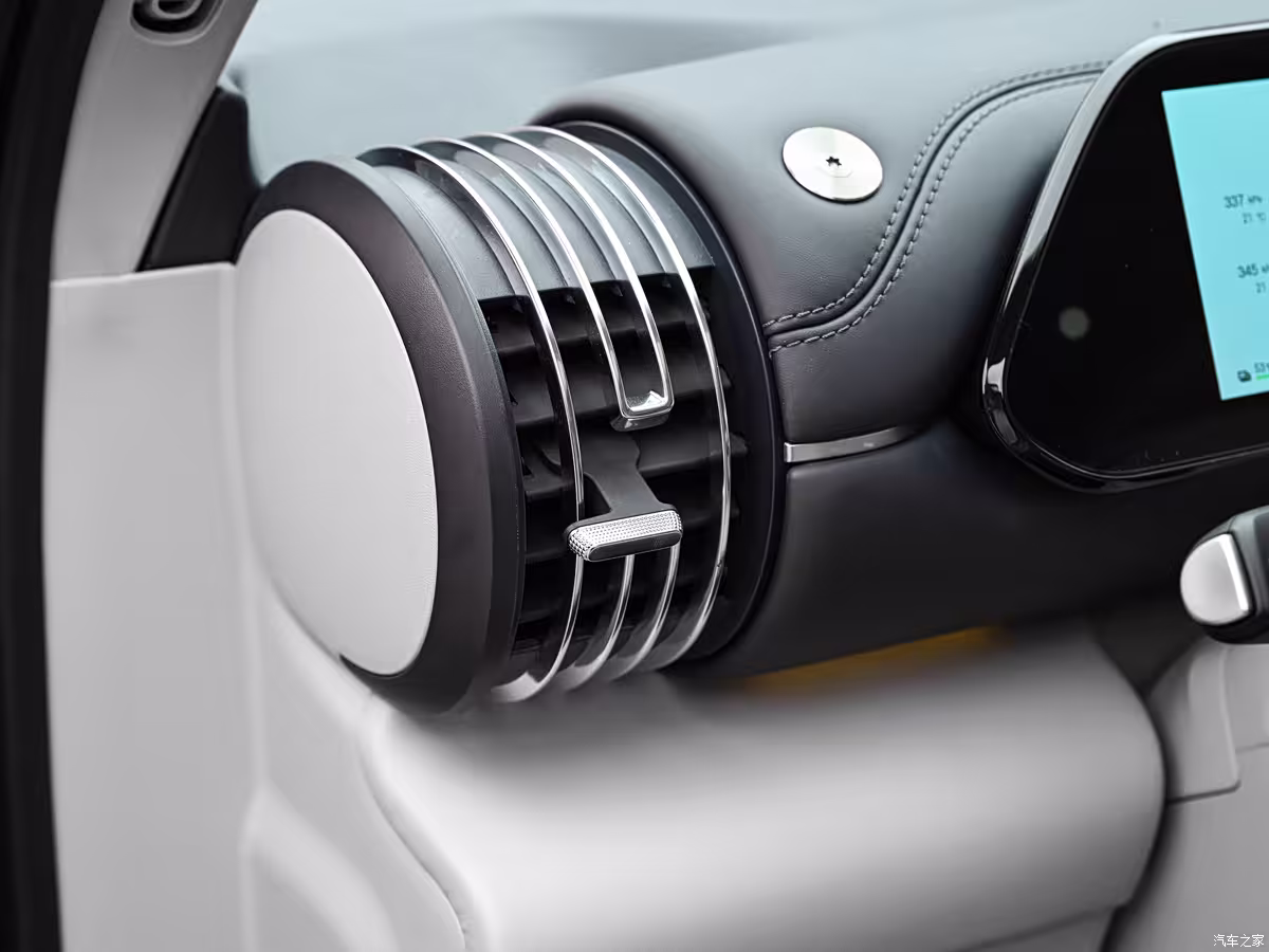 BYD Yuan Plus interior with large touchscreen, wireless charging pad, and ambient lighting