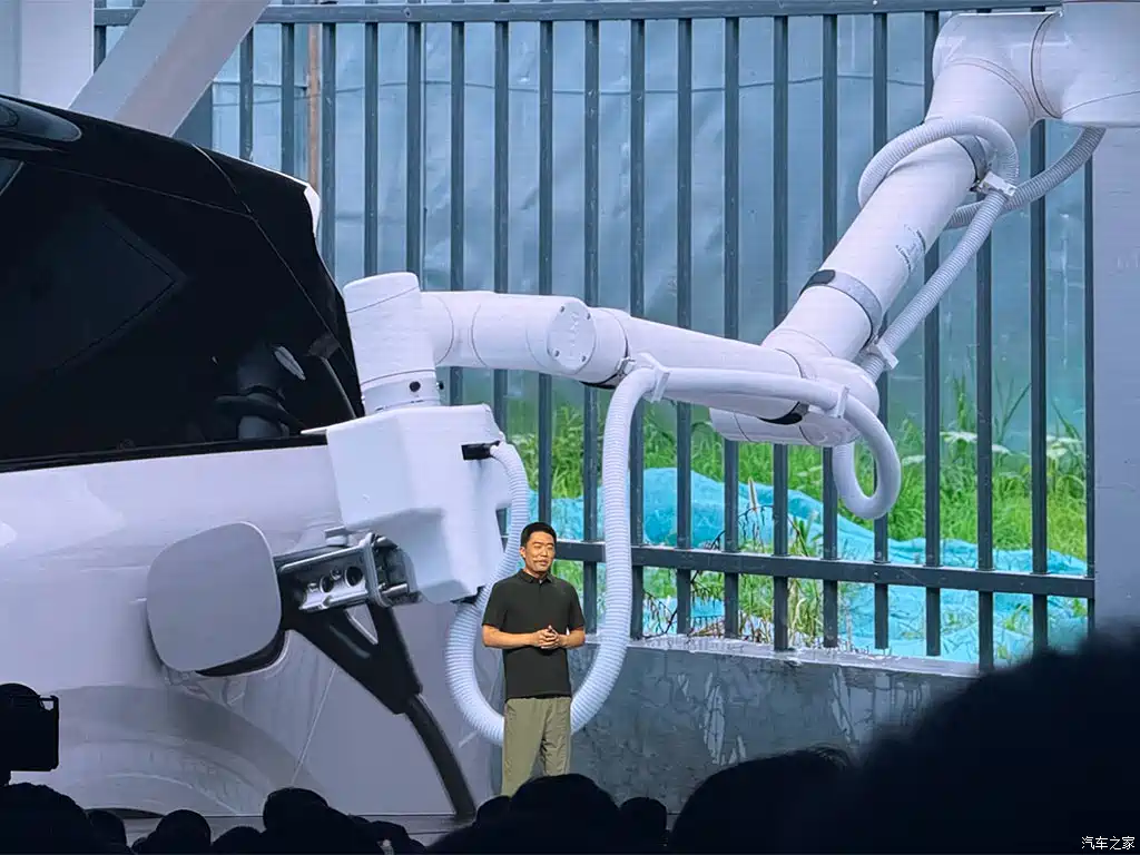 "Xiaomi robotic charging arm automatically plugging into an electric vehicle at home"